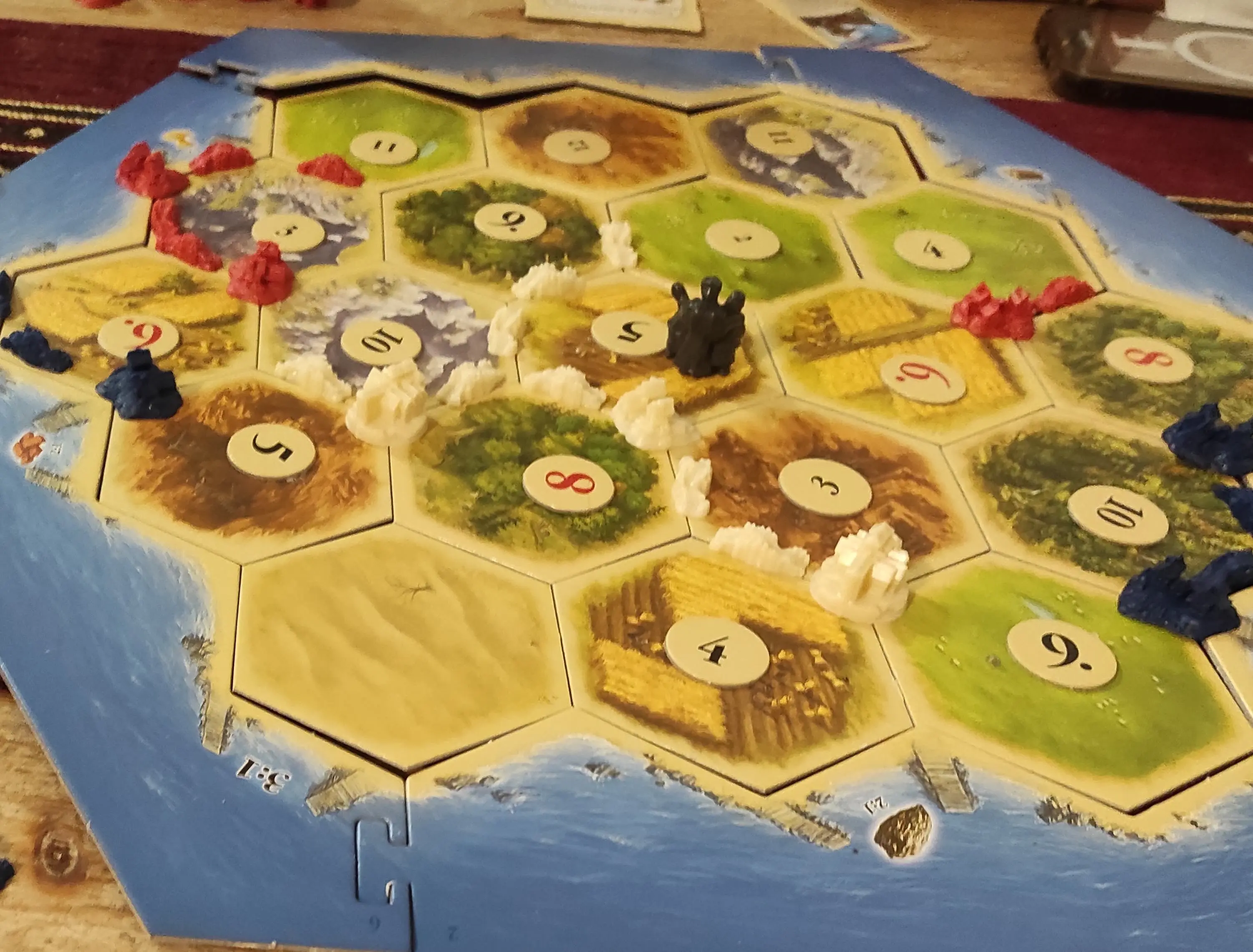 Les ressources étaient trop rares pour les bleus foncés Le plateau d'une partie de jeu Les Colons de Catane